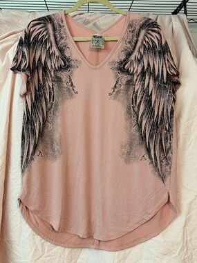 Amazing top by Vocal. Size small but fits loosely.